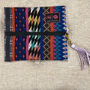 Makeup junkie small woven bag. Multicolor, purple tassle